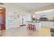 Eat-in kitchen with island, granite countertops, and double ovens at 1241 Gulf Of Mexico Dr # 708, Longboat Key, FL 34228
