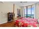 Main bedroom with ocean views and a four-poster bed at 1241 Gulf Of Mexico Dr # 708, Longboat Key, FL 34228