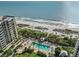 Aerial view of resort with pool, beach access, and ocean views at 1241 Gulf Of Mexico Dr # 708, Longboat Key, FL 34228