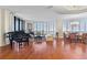 Spacious living room with hardwood floors, large windows, and ample natural light at 1241 Gulf Of Mexico Dr # 708, Longboat Key, FL 34228