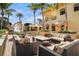 Outdoor patio area with comfortable seating and fire pit at 1241 Gulf Of Mexico Dr # 708, Longboat Key, FL 34228