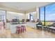 Island kitchen with granite countertops, white cabinets, and ocean views at 1241 Gulf Of Mexico Dr # 708, Longboat Key, FL 34228