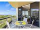 Spacious balcony with view of water and lush greenery at 1241 Gulf Of Mexico Dr # 708, Longboat Key, FL 34228
