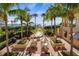 Relaxing courtyard with fountain, seating, and ocean views at 1241 Gulf Of Mexico Dr # 708, Longboat Key, FL 34228