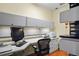 Functional home office with built-in shelving and desk at 1241 Gulf Of Mexico Dr # 708, Longboat Key, FL 34228