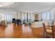 Spacious living room with hardwood floors, large windows, and ocean views at 1241 Gulf Of Mexico Dr # 708, Longboat Key, FL 34228