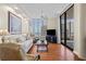 Bright living room with hardwood floors, ocean views, and comfortable seating at 1241 Gulf Of Mexico Dr # 708, Longboat Key, FL 34228