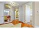 Bright hallway with hardwood floors and access to bedrooms and bathrooms at 1241 Gulf Of Mexico Dr # 708, Longboat Key, FL 34228