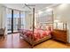 Main bedroom with king-size bed and access to balcony at 1241 Gulf Of Mexico Dr # 708, Longboat Key, FL 34228
