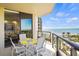 Private balcony with ocean view and outdoor seating at 1241 Gulf Of Mexico Dr # 708, Longboat Key, FL 34228