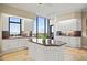 Gourmet kitchen with island, granite countertops, and white cabinetry at 1241 Gulf Of Mexico Dr # 708, Longboat Key, FL 34228
