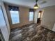 Bright bedroom with wood-look floors and access to a bathroom at 705 50Th Avenue W Dr, Bradenton, FL 34207