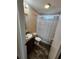 Clean bathroom with tub shower, wood-look floor, and vanity at 705 50Th Avenue W Dr, Bradenton, FL 34207