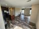 Open living room with wood-look floors and lots of natural light at 705 50Th Avenue W Dr, Bradenton, FL 34207