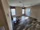 Spacious living room with wood-look flooring and ceiling fan at 705 50Th Avenue W Dr, Bradenton, FL 34207