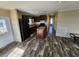 Modern kitchen with island, stainless steel appliances, and wood-look flooring at 705 50Th Avenue W Dr, Bradenton, FL 34207