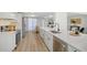 Modern kitchen with white shaker cabinets, stainless steel appliances, and quartz countertops at 3442 Fairview Dr, Sarasota, FL 34239