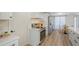 Bright kitchen boasts stainless steel appliances and white cabinetry, offering ample counter space at 3442 Fairview Dr, Sarasota, FL 34239