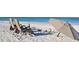 Relaxing beach scene with chairs, umbrella, and ocean view at 3442 Fairview Dr, Sarasota, FL 34239