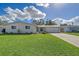 Newly renovated single story home with attached garage and well-maintained lawn at 3442 Fairview Dr, Sarasota, FL 34239