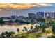 Aerial sunset view of Sarasota Bay area with palm trees and buildings at 3442 Fairview Dr, Sarasota, FL 34239