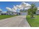 Ranch-style home with a two-car garage and landscaped yard at 3442 Fairview Dr, Sarasota, FL 34239