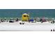 Beach with lifeguard stand and people enjoying the sun at 3442 Fairview Dr, Sarasota, FL 34239