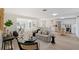 Open concept living space featuring a modern sofa and kitchen views at 3442 Fairview Dr, Sarasota, FL 34239