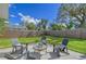 Private backyard with patio furniture and a wooden fence at 3442 Fairview Dr, Sarasota, FL 34239