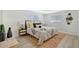 Cozy bedroom with a neutral color palette, wicker nightstands, and a large bed at 3442 Fairview Dr, Sarasota, FL 34239