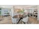Bright dining area with modern table and chairs, open to the living room and kitchen at 3442 Fairview Dr, Sarasota, FL 34239