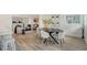 Modern dining area features an oval table with stylish chairs, adjacent to the kitchen and living room at 3442 Fairview Dr, Sarasota, FL 34239
