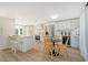 Modern kitchen featuring white shaker cabinets, stainless steel appliances, and a breakfast bar at 3442 Fairview Dr, Sarasota, FL 34239