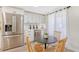 Cozy breakfast nook with a round table and four light wood chairs at 3442 Fairview Dr, Sarasota, FL 34239