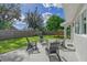 Spacious backyard with patio, seating area, and grassy lawn at 3442 Fairview Dr, Sarasota, FL 34239