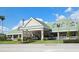 Restaurant building with a green roof and welcoming entrance at 3442 Fairview Dr, Sarasota, FL 34239
