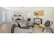 Spacious living area featuring a comfortable sofa and stylish decor at 3442 Fairview Dr, Sarasota, FL 34239
