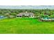 Community clubhouse surrounded by lush landscaping at 10444 48Th E Ct, Parrish, FL 34219