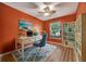 Staged home office with ample storage, natural lighting and a calming color scheme at 10444 48Th E Ct, Parrish, FL 34219