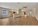 Spacious living room with hardwood floors, kitchen access and ample natural light at 10444 48Th E Ct, Parrish, FL 34219