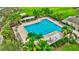 Large community pool with plenty of lounge chairs at 10444 48Th E Ct, Parrish, FL 34219