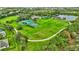 Community green space with walking path and sports courts at 10444 48Th E Ct, Parrish, FL 34219