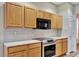 Well-equipped kitchen, boasting ample cabinetry and granite countertops at 10444 48Th E Ct, Parrish, FL 34219