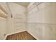 Empty walk-in closet with laminate flooring and wire shelving for ample storage space at 10444 48Th E Ct, Parrish, FL 34219