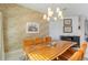 Elegant dining area with a stunning live-edge wooden table at 11806 Oak Ridge Dr, Parrish, FL 34219