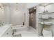 Spa-like bathroom with walk-in shower and marble finishes at 11806 Oak Ridge Dr, Parrish, FL 34219