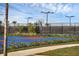 Outdoor basketball court with blue and red surface at 15967 Clear Skies Pl, Lakewood Ranch, FL 34211