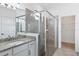 Bathroom with granite countertop, large mirror, and walk-in shower at 15967 Clear Skies Pl, Lakewood Ranch, FL 34211