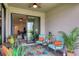 Covered patio with view into living area and pond at 15967 Clear Skies Pl, Lakewood Ranch, FL 34211