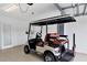 Garage with golf cart, showing off ample space at 15967 Clear Skies Pl, Lakewood Ranch, FL 34211